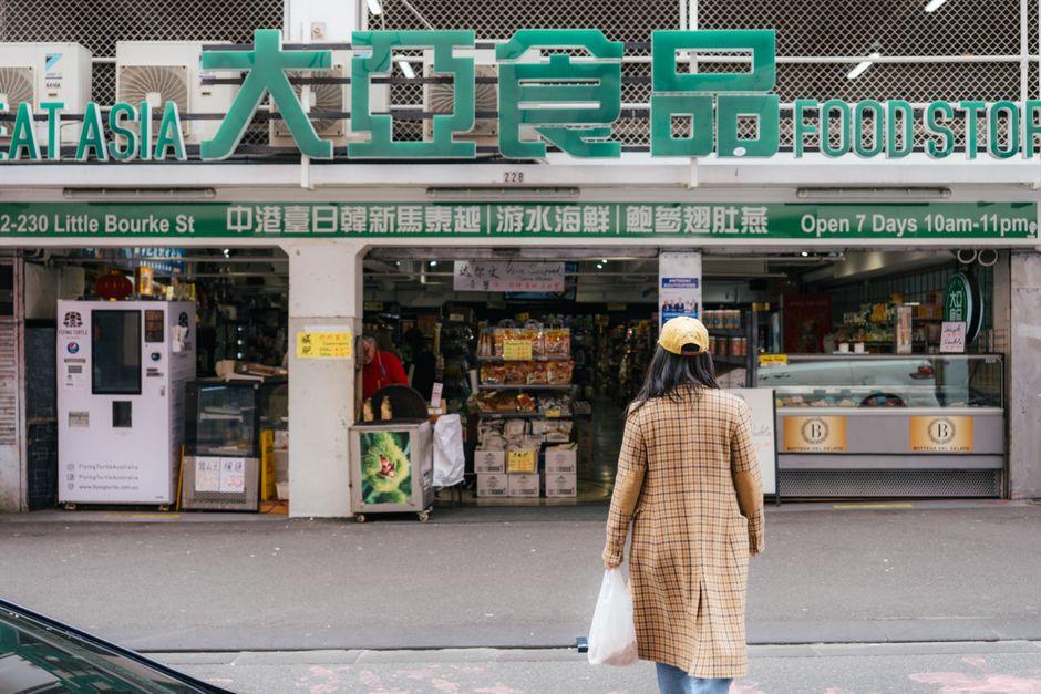 Woman in Chinatown Melbourne Grocery Store Front